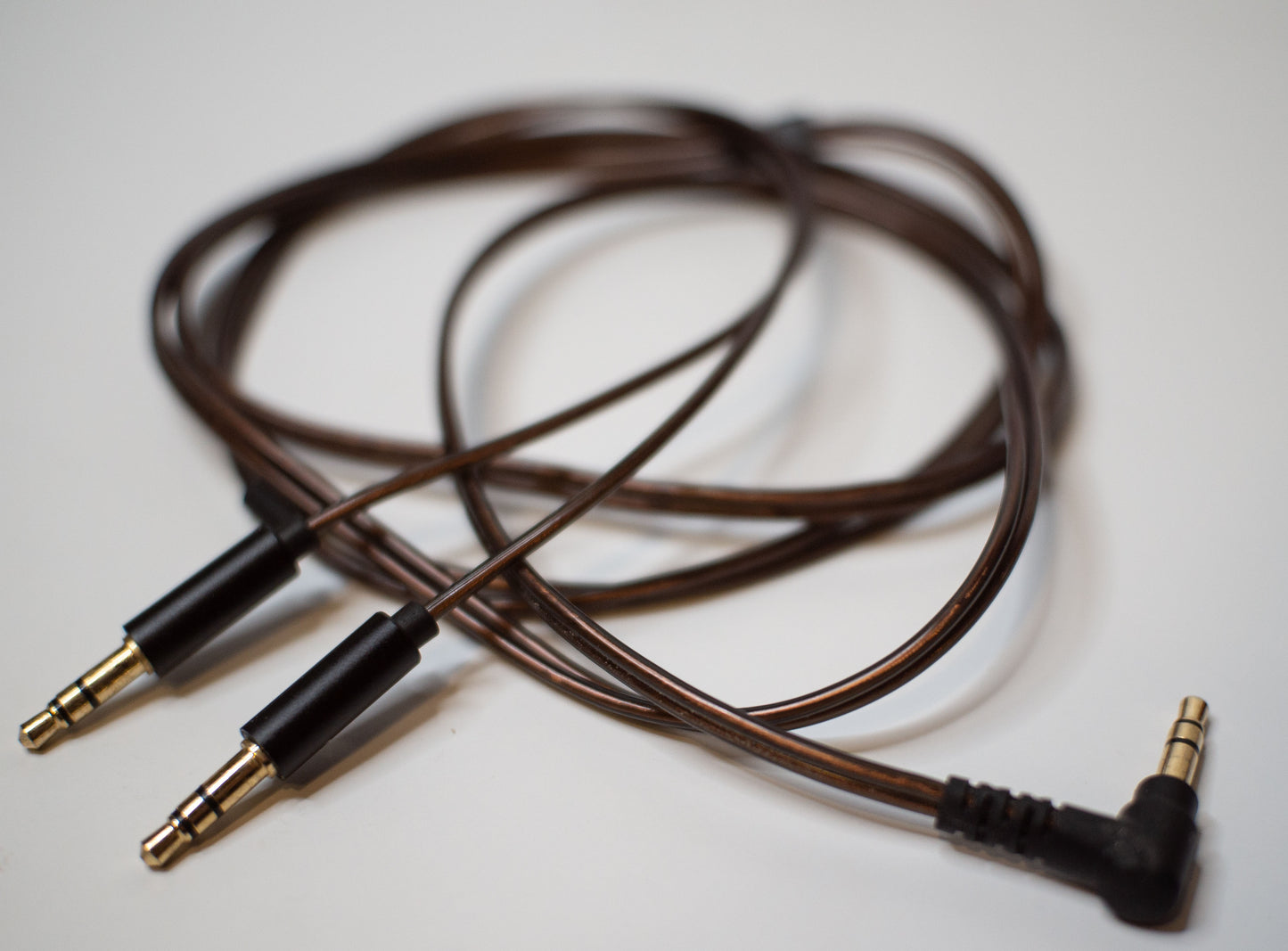 Basic ~45 inch brown dual plug 3.5mm cable. Very light and flimsy, but works well. May be substituted later on with a black cable depending on stock situations.